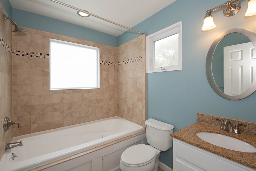 27 Margaret Road Hamilton, MA 01982 - Photo 22 of 30 a bathroom with a granite countertop toilet a sink and bathtub