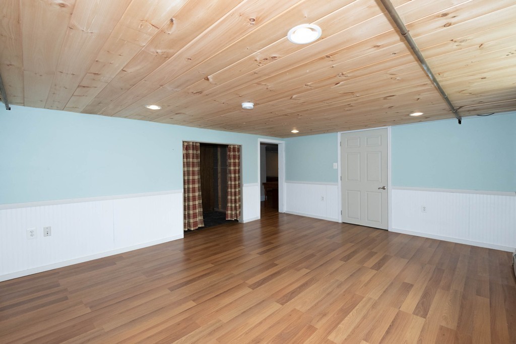 27 Margaret Road Hamilton, MA 01982 - Photo 25 of 30 a view of an empty room with wooden floor