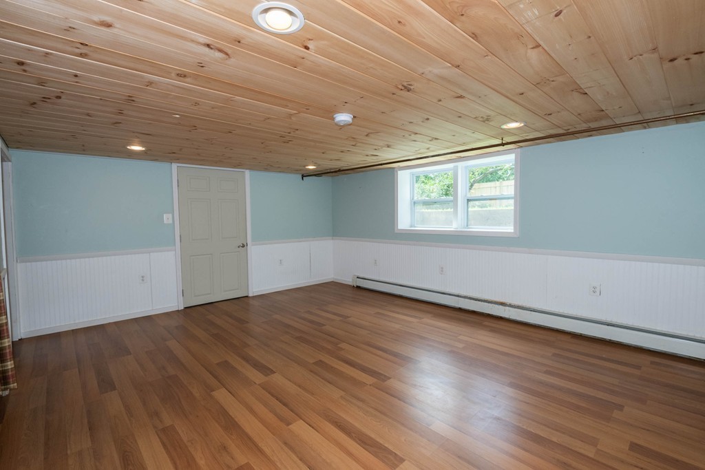 27 Margaret Road Hamilton, MA 01982 - Photo 26 of 30 an empty room with wooden floor and windows