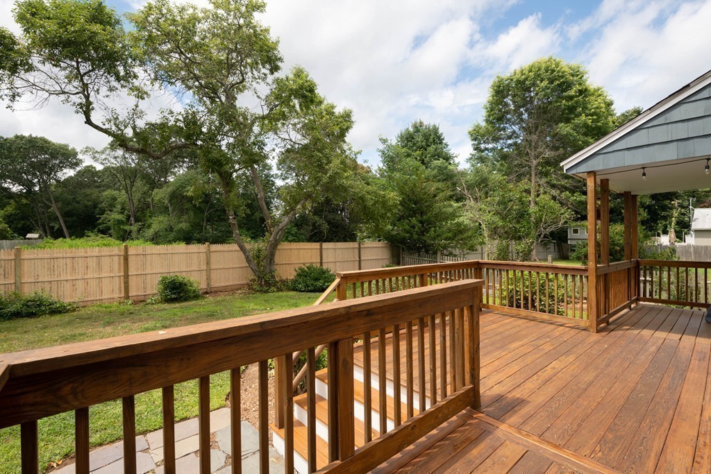 27 Margaret Road Hamilton, MA 01982 - Photo 27 of 30 a view of deck and a yard with wooden fence