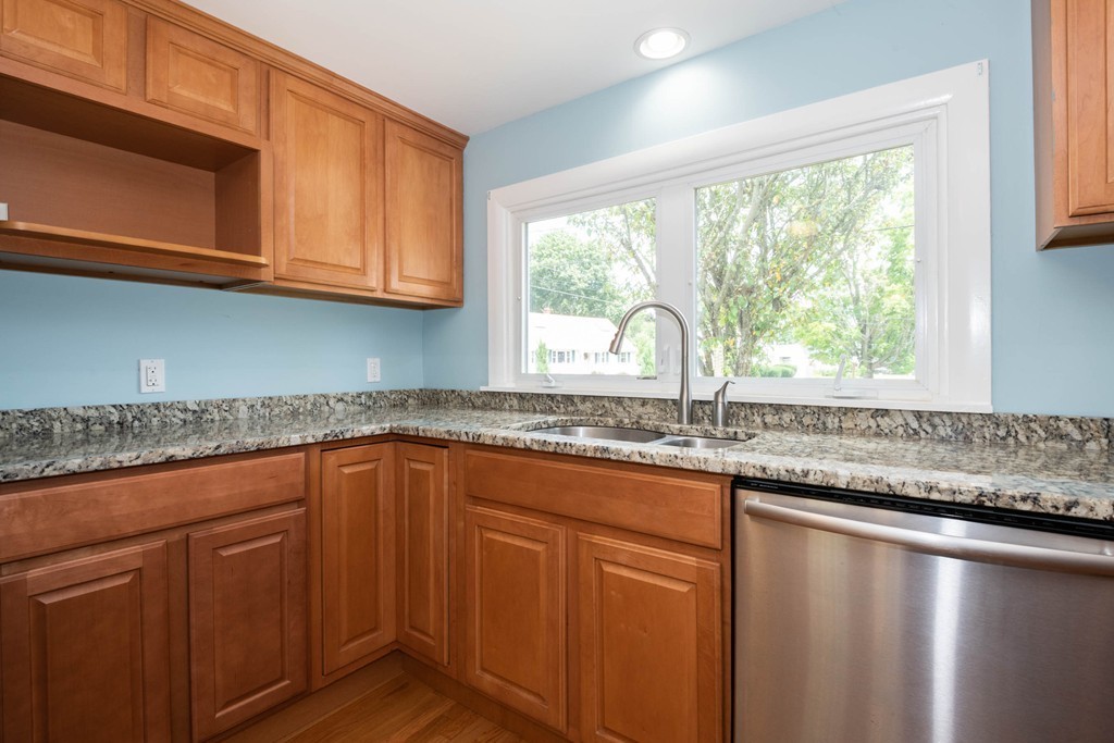 27 Margaret Road Hamilton, MA 01982 - Photo 8 of 30 a kitchen with granite countertop a sink and a window