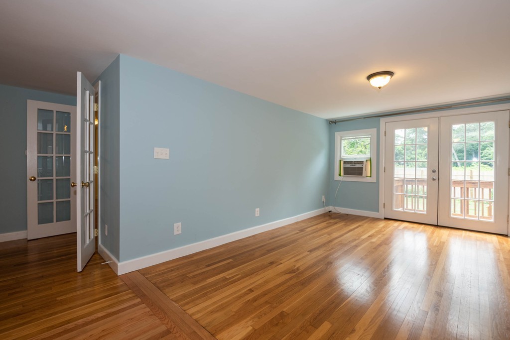 27 Margaret Road Hamilton, MA 01982 - Photo 9 of 30 an empty room with wooden floor and windows