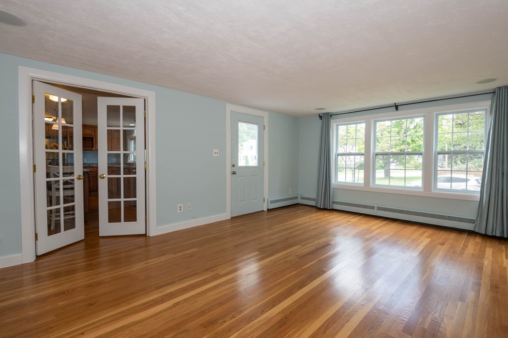 27 Margaret Road Hamilton, MA 01982 - Photo 10 of 30 a view of empty room with wooden floor and fan