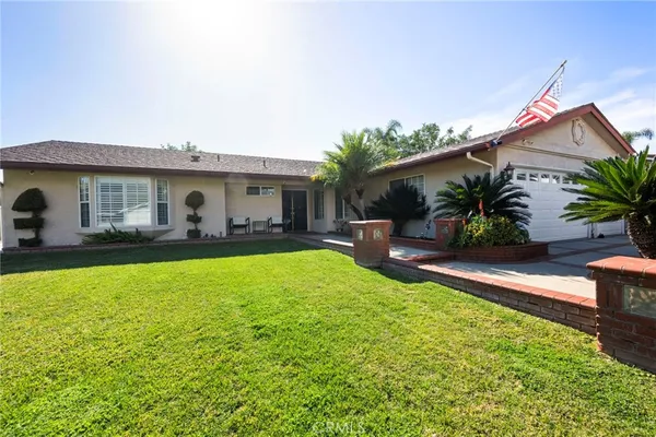 a house view with a garden space