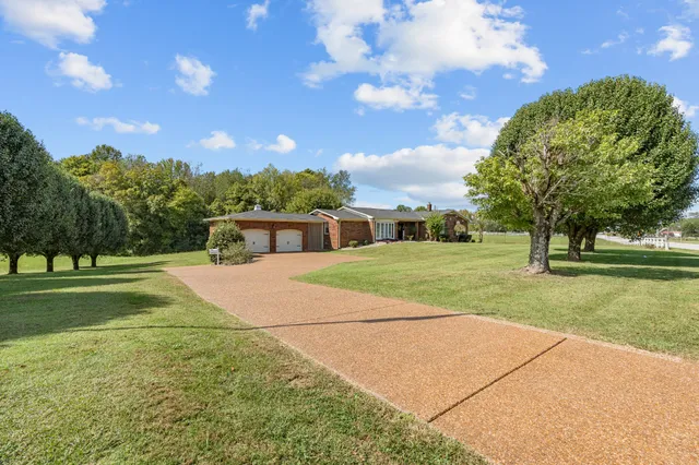 a view of a house with a big yard