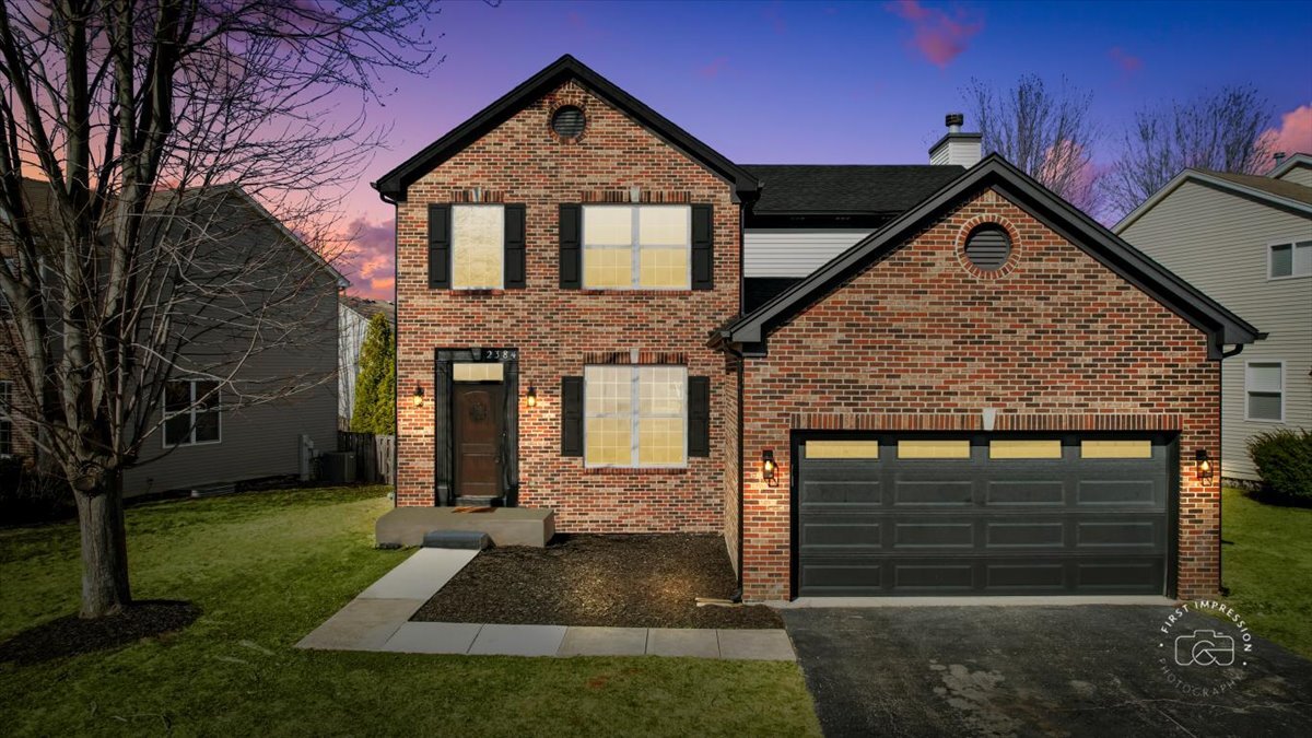 2384 Shiloh Drive Aurora, IL 60503 - Photo 1 of 1 a front view of a house with garden