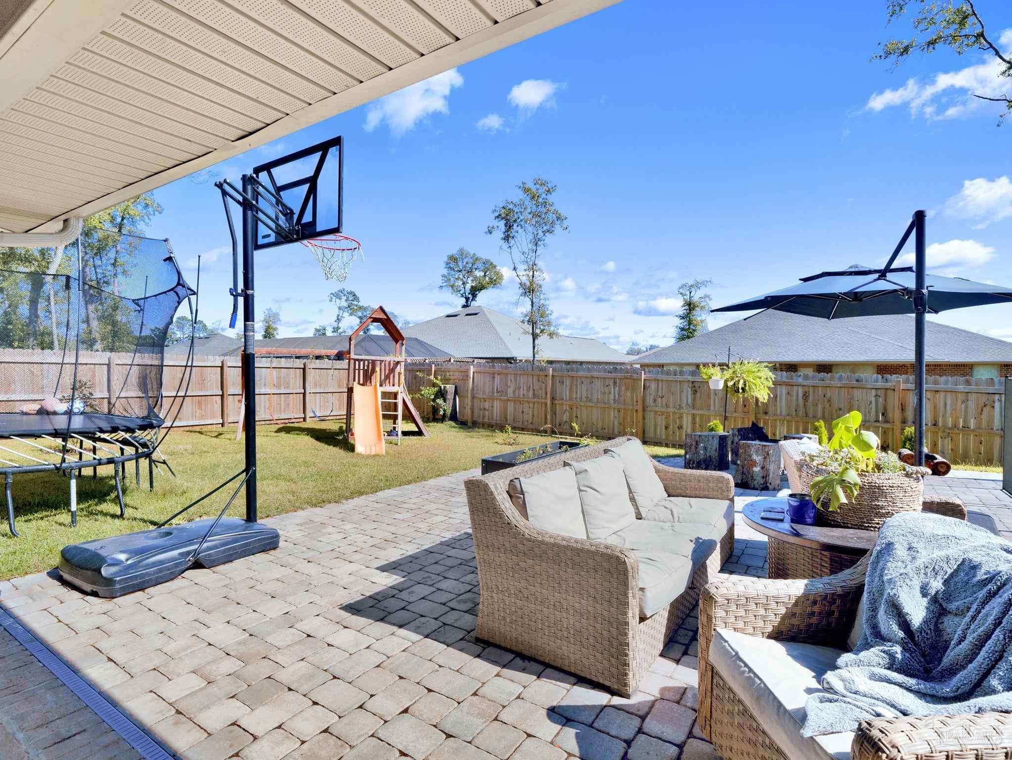 5956 Parsonage Circle Milton, FL 32570 - Photo 11 of 66 a view of a patio with couches and potted plants