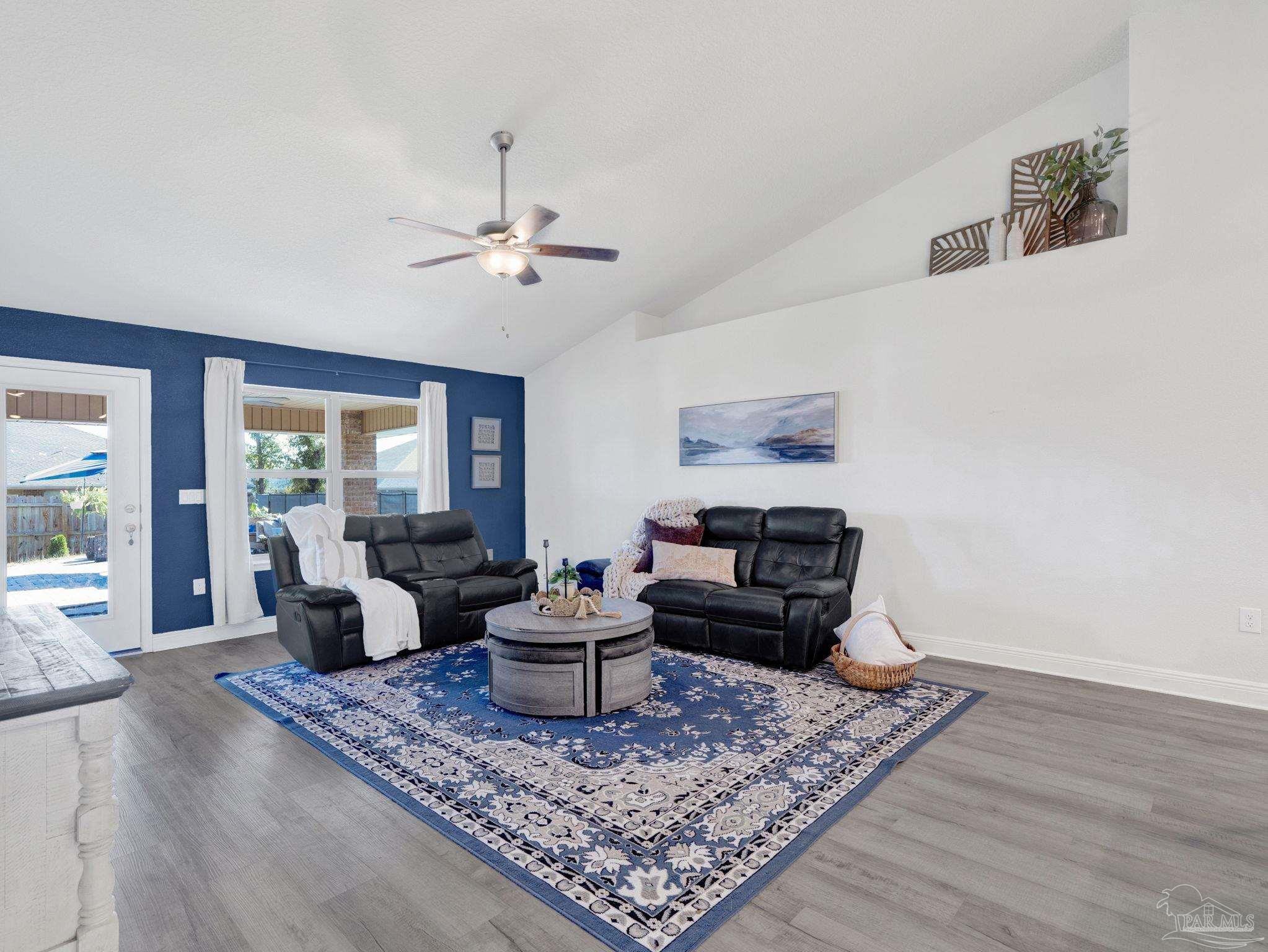 5956 Parsonage Circle Milton, FL 32570 - Photo 23 of 66 a living room with furniture and a rug