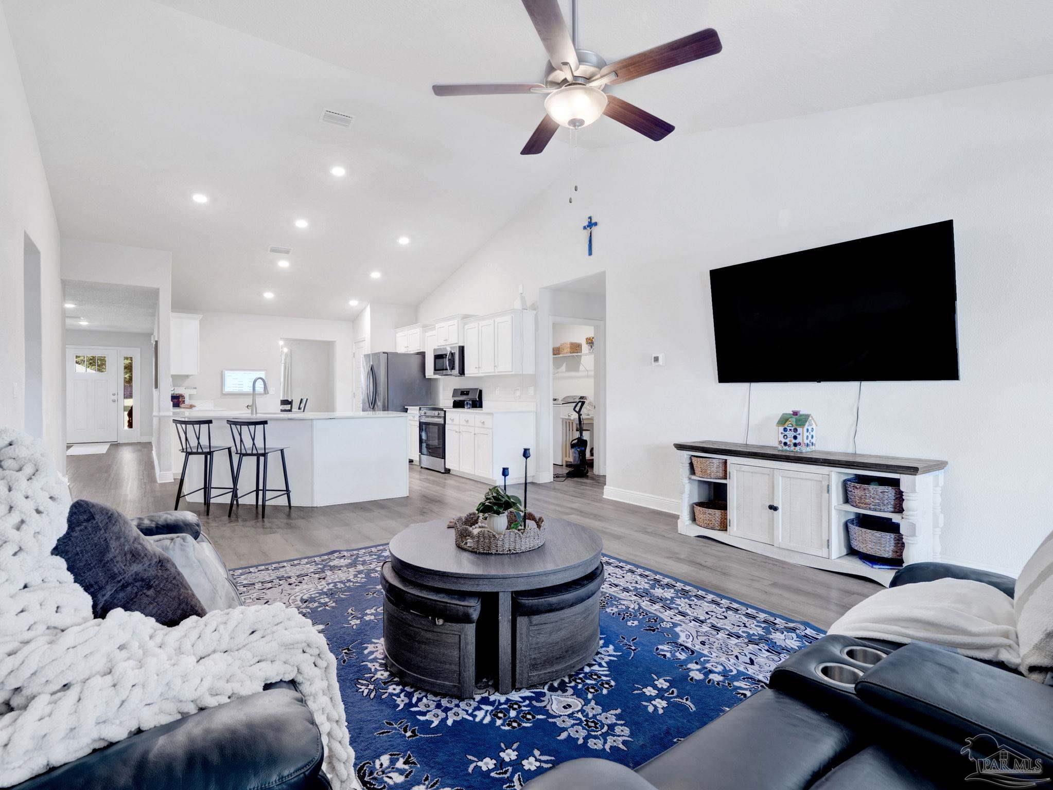 5956 Parsonage Circle Milton, FL 32570 - Photo 24 of 66 a living room with furniture and a flat screen tv