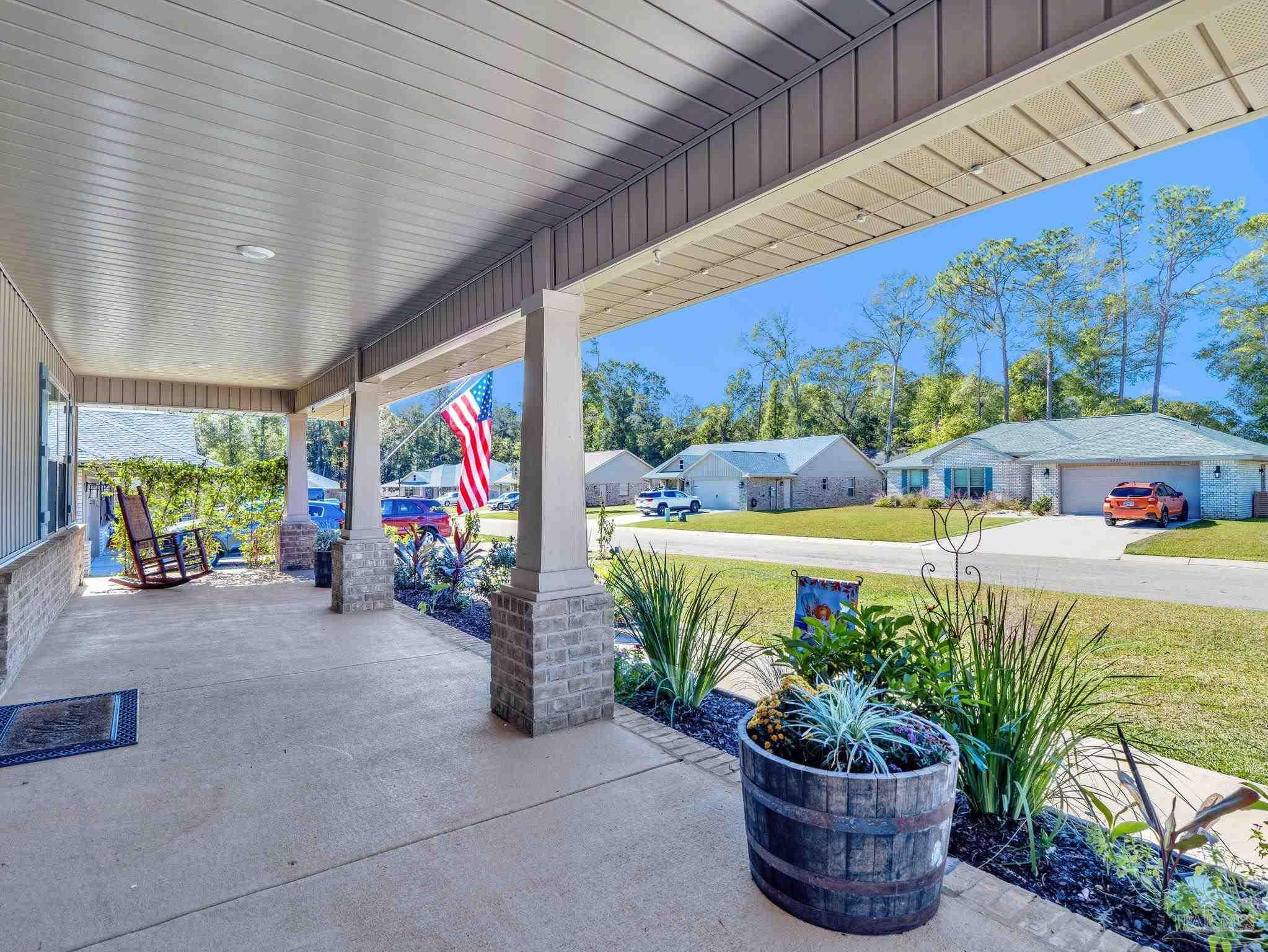 5956 Parsonage Circle Milton, FL 32570 - Photo 3 of 66 a view of a patio with a table and chairs