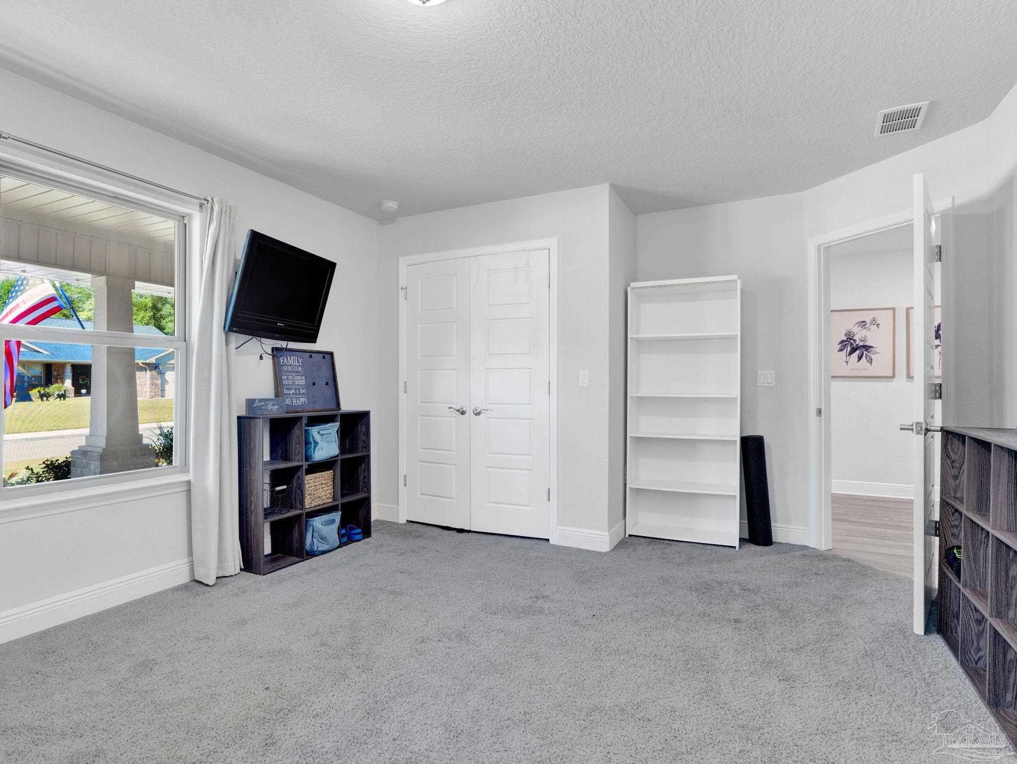 5956 Parsonage Circle Milton, FL 32570 - Photo 33 of 66 a view of a room with cabinet and closet
