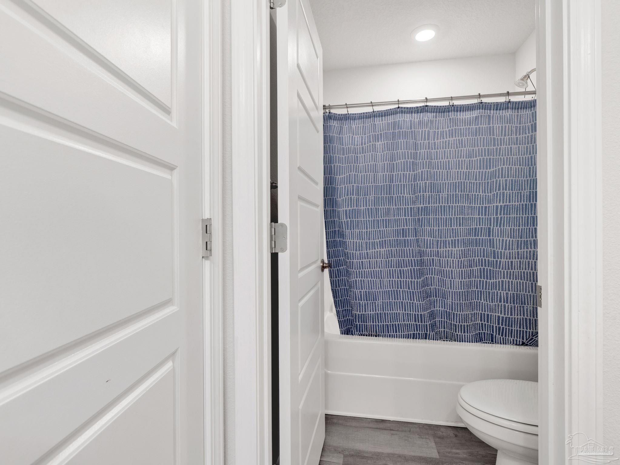 5956 Parsonage Circle Milton, FL 32570 - Photo 36 of 66 a bathroom with a shower and a toilet