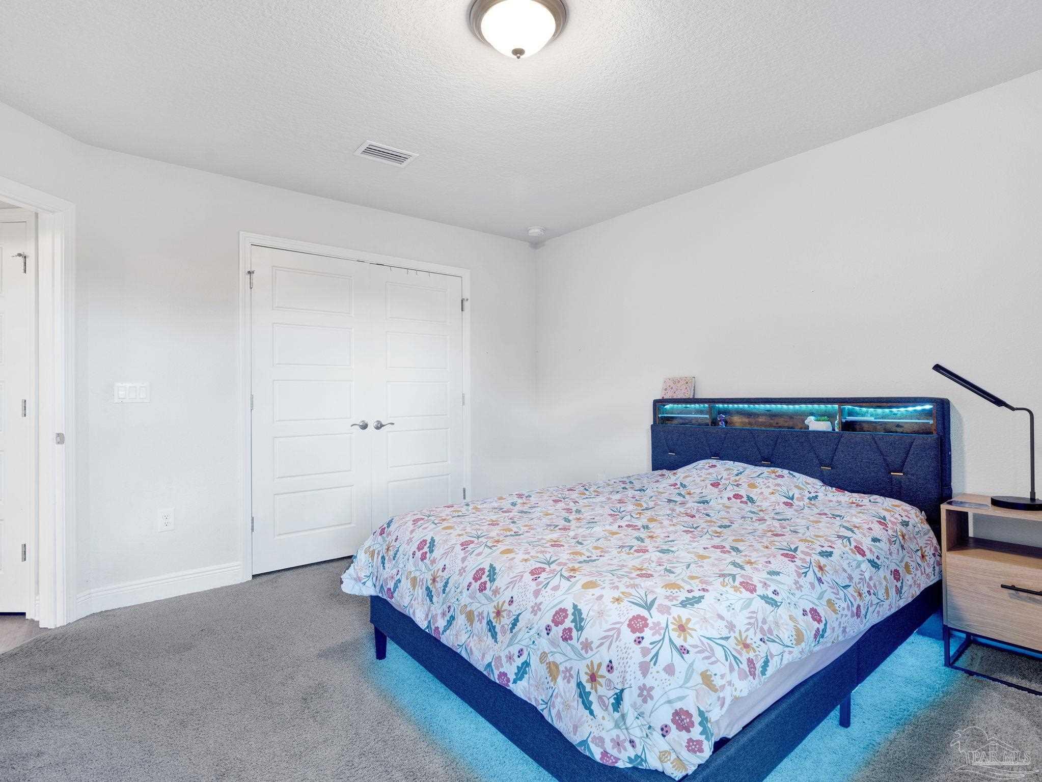 5956 Parsonage Circle Milton, FL 32570 - Photo 41 of 66 a bedroom with a bed and window