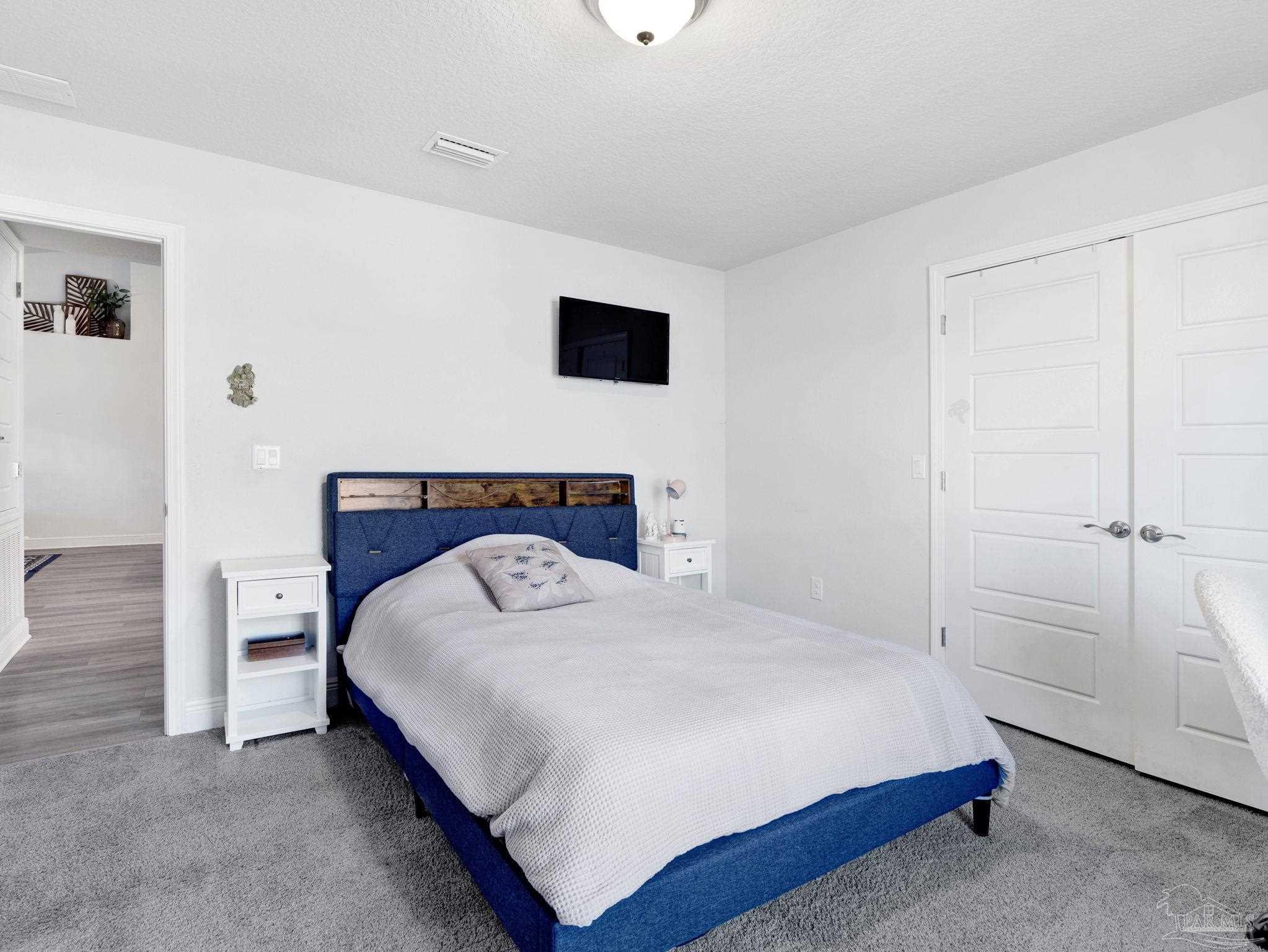 5956 Parsonage Circle Milton, FL 32570 - Photo 46 of 66 a bedroom with a bed and closet