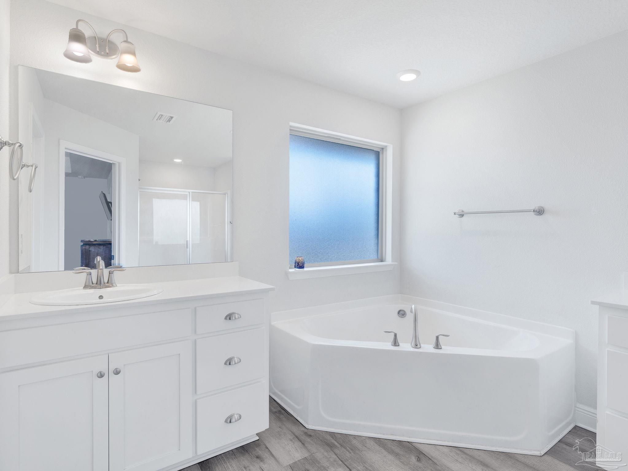 5956 Parsonage Circle Milton, FL 32570 - Photo 51 of 66 a bathroom with a bathtub and a sink