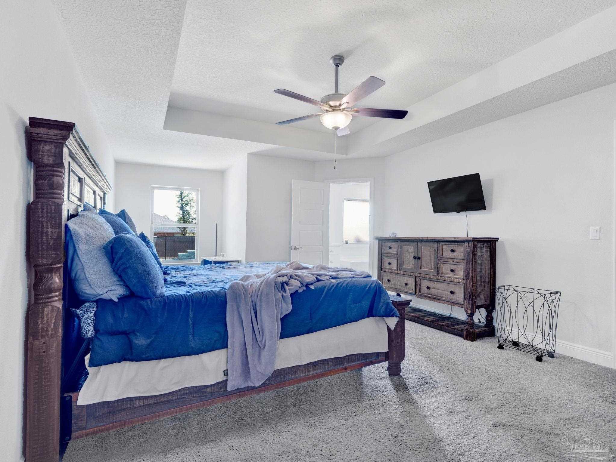 5956 Parsonage Circle Milton, FL 32570 - Photo 55 of 66 a living room with furniture and a flat screen tv