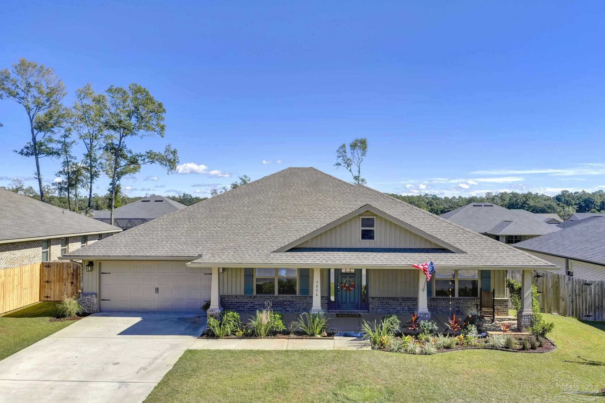 5956 Parsonage Circle Milton, FL 32570 - Photo 62 of 66 a view of a house with swimming pool and a yard