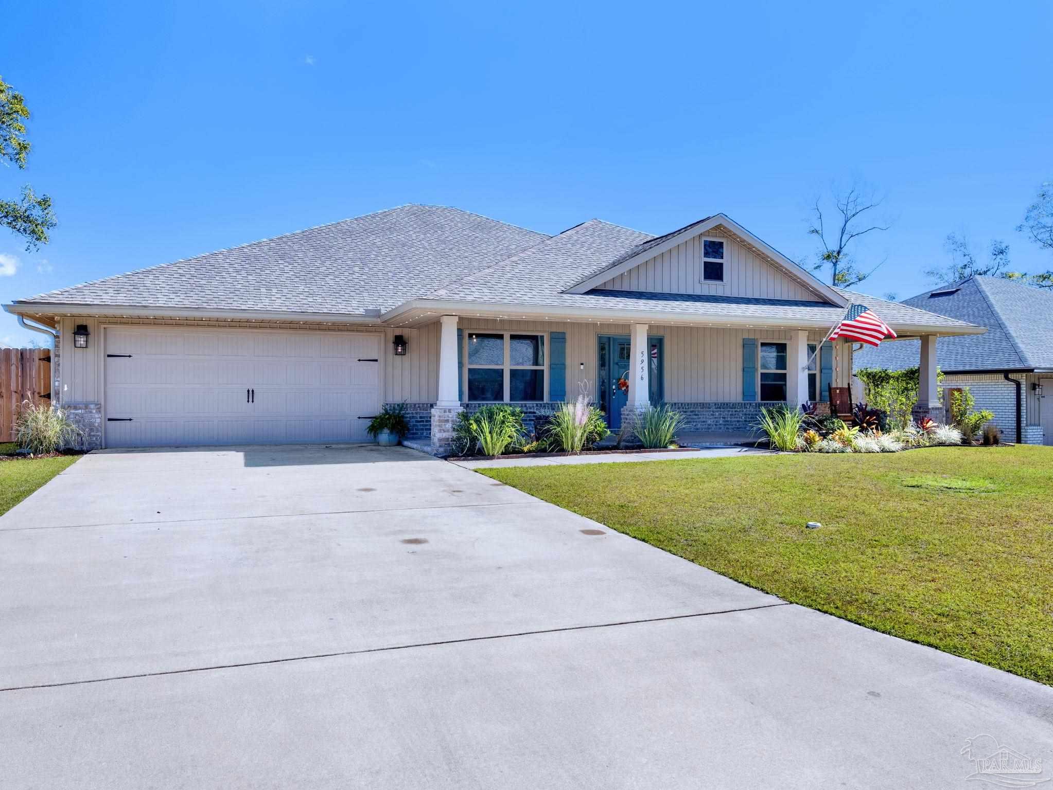 5956 Parsonage Circle Milton, FL 32570 - Photo 66 of 66 a front view of a house with a yard