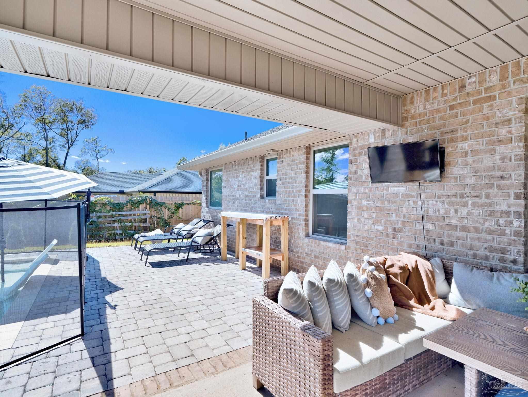 5956 Parsonage Circle Milton, FL 32570 - Photo 7 of 66 a living room with furniture and a flat screen tv