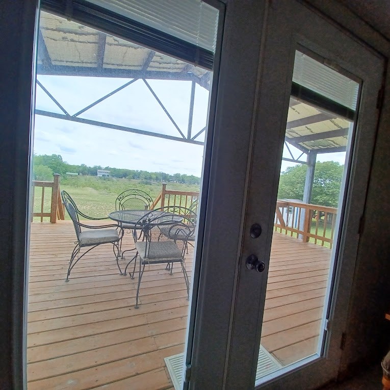 8438 Whartons Dock Road Bandera, TX 78003 - Photo 12 of 20 Living room to covered deck