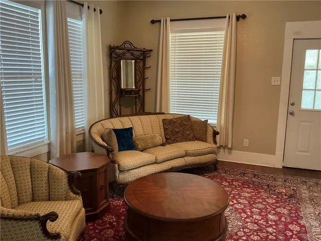 a spacious bedroom with a bed and a window