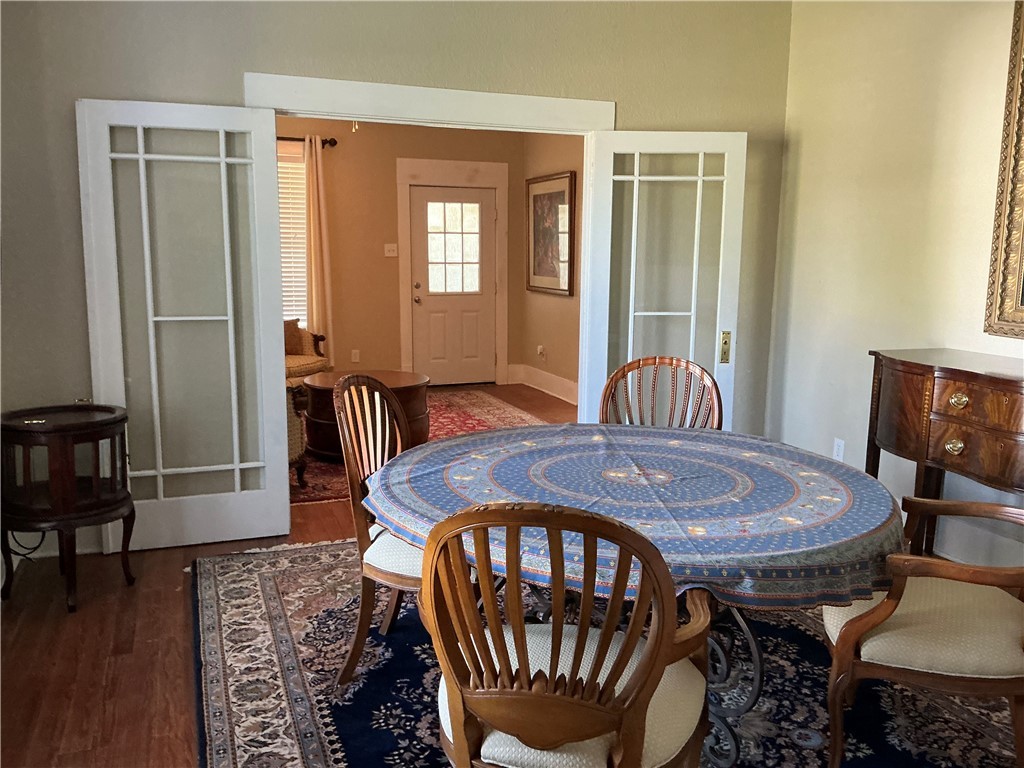 207 North Archer Street Groesbeck, TX 76642 - Photo 19 of 25 a dining room with furniture and wooden floor