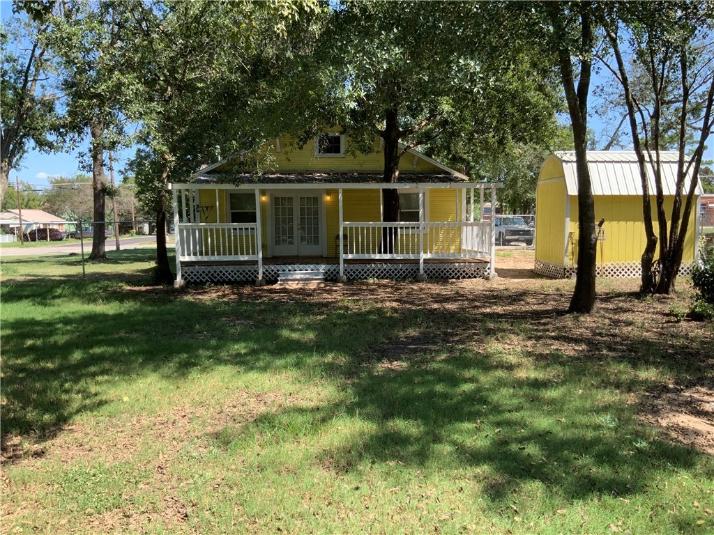 207 North Archer Street Groesbeck, TX 76642 - Photo 2 of 25 a view of a house with backyard and trees