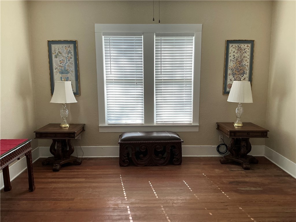 207 North Archer Street Groesbeck, TX 76642 - Photo 21 of 25 a spacious bedroom with a bed and a window