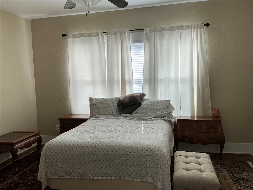 207 North Archer Street Groesbeck, TX 76642 - Photo 23 of 25 a bedroom with a bed and a window