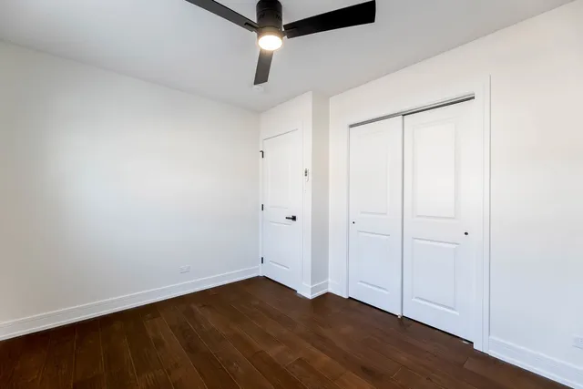 an empty room with wooden floor
