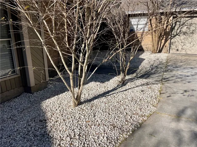 a view of a house with a snow in the yard