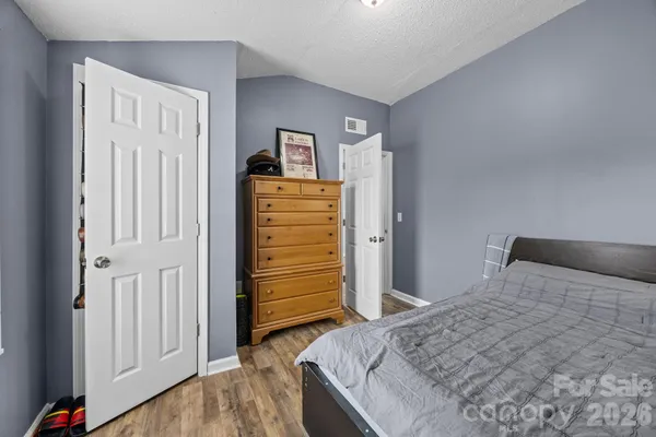 a bedroom with a bed and a closet