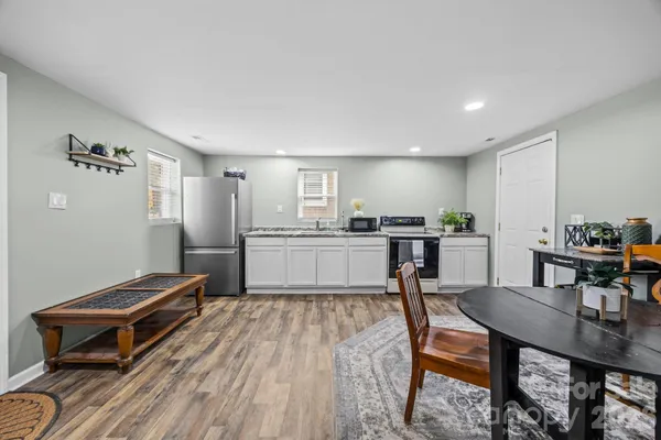 a kitchen with a table and chairs in it