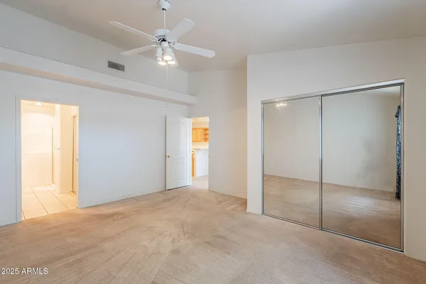 a view of an empty room with a window