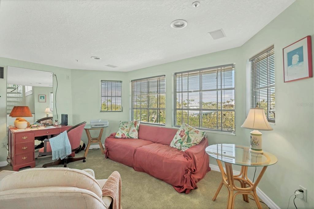 1660 16th Street East Boca Grande, FL 33921 - Photo 14 of 48 a living room with furniture and a window