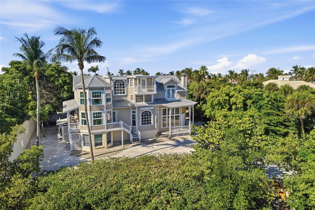 1660 16th Street East Boca Grande, FL 33921 - Photo 29 of 48 front view of a house with a garden