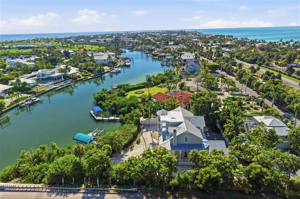 1660 16th Street East Boca Grande, FL 33921 - Photo 36 of 48 an aerial view of residential houses with outdoor space and lake view