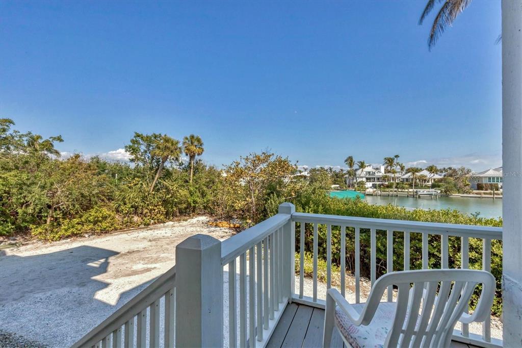 1660 16th Street East Boca Grande, FL 33921 - Photo 44 of 54 a view of a balcony with wooden fence and floor
