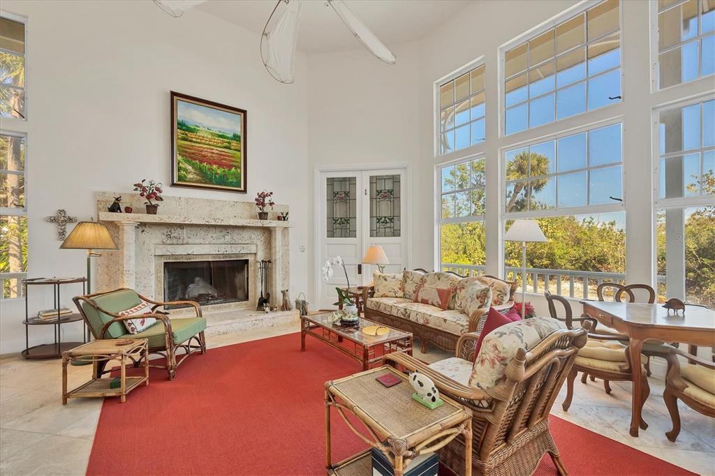 1660 16th Street East Boca Grande, FL 33921 - Photo 5 of 48 a living room with furniture and a fireplace