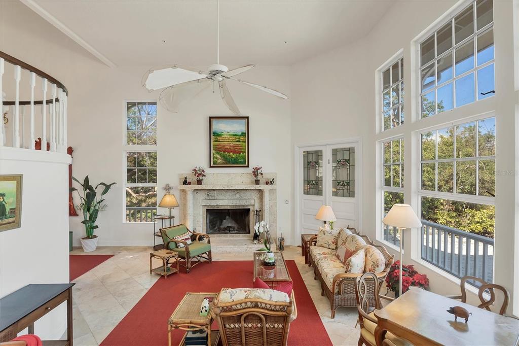 1660 16th Street East Boca Grande, FL 33921 - Photo 6 of 48 a living room with furniture and a fireplace