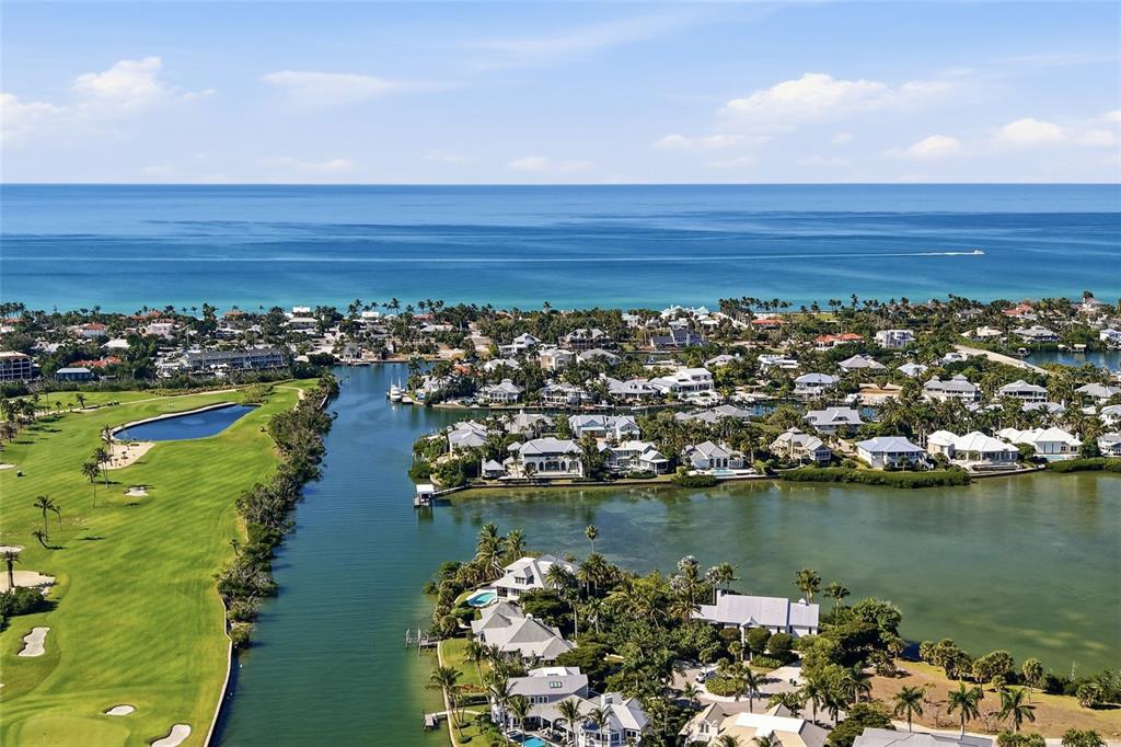 1660 16th Street East Boca Grande, FL 33921 - Photo 7 of 54 an aerial view of a house with a lake view