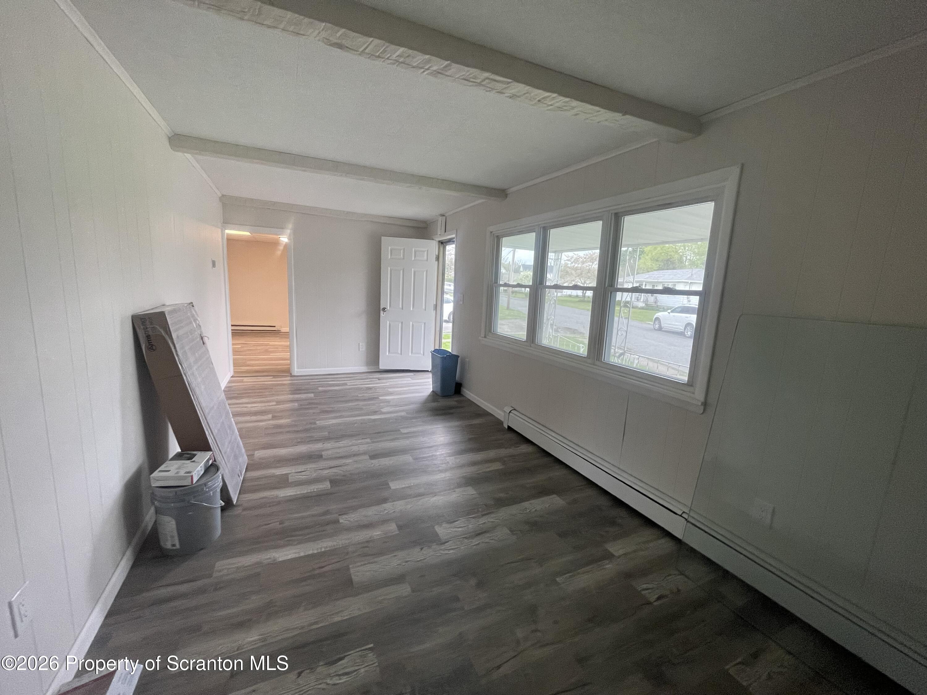 238 George Street Moosic, PA 18507 - Photo 9 of 23 a view of a room with wooden floor and chair