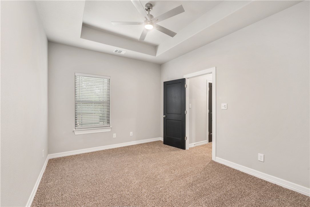 705 Turner Street College Station, TX 77840 - Photo 14 of 19 an empty room with windows and fan