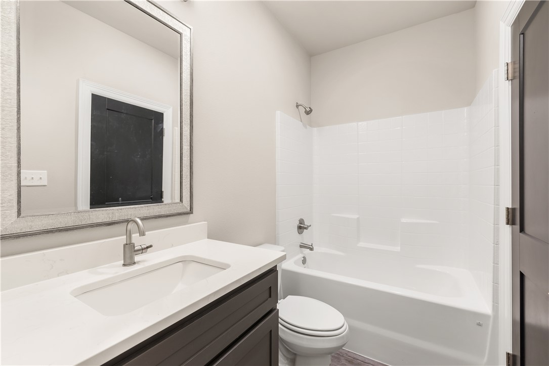705 Turner Street College Station, TX 77840 - Photo 18 of 19 a bathroom with a sink and a mirror