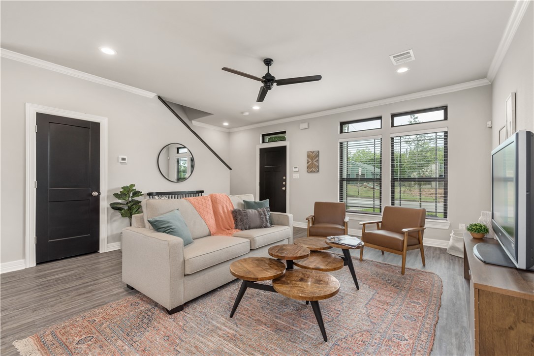 705 Turner Street College Station, TX 77840 - Photo 4 of 19 a living room with furniture and a large window