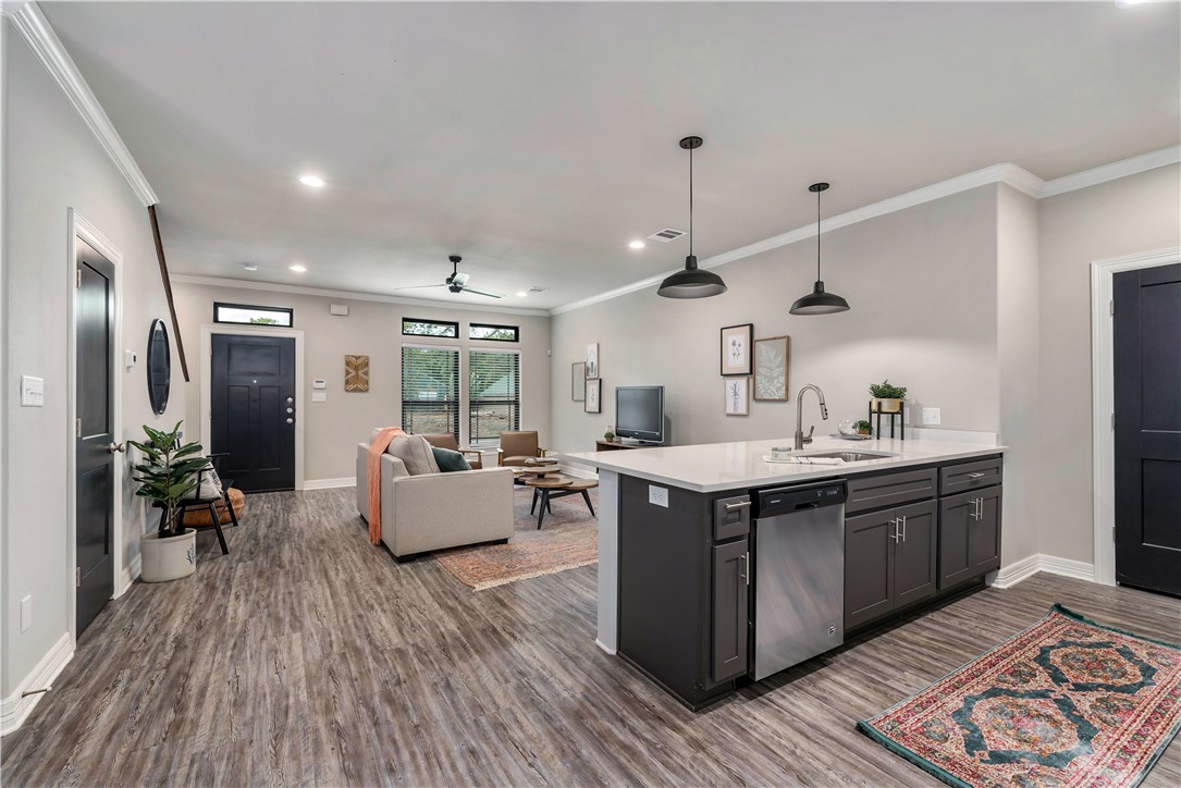705 Turner Street College Station, TX 77840 - Photo 9 of 19 a kitchen with a stove cabinets and wooden floor