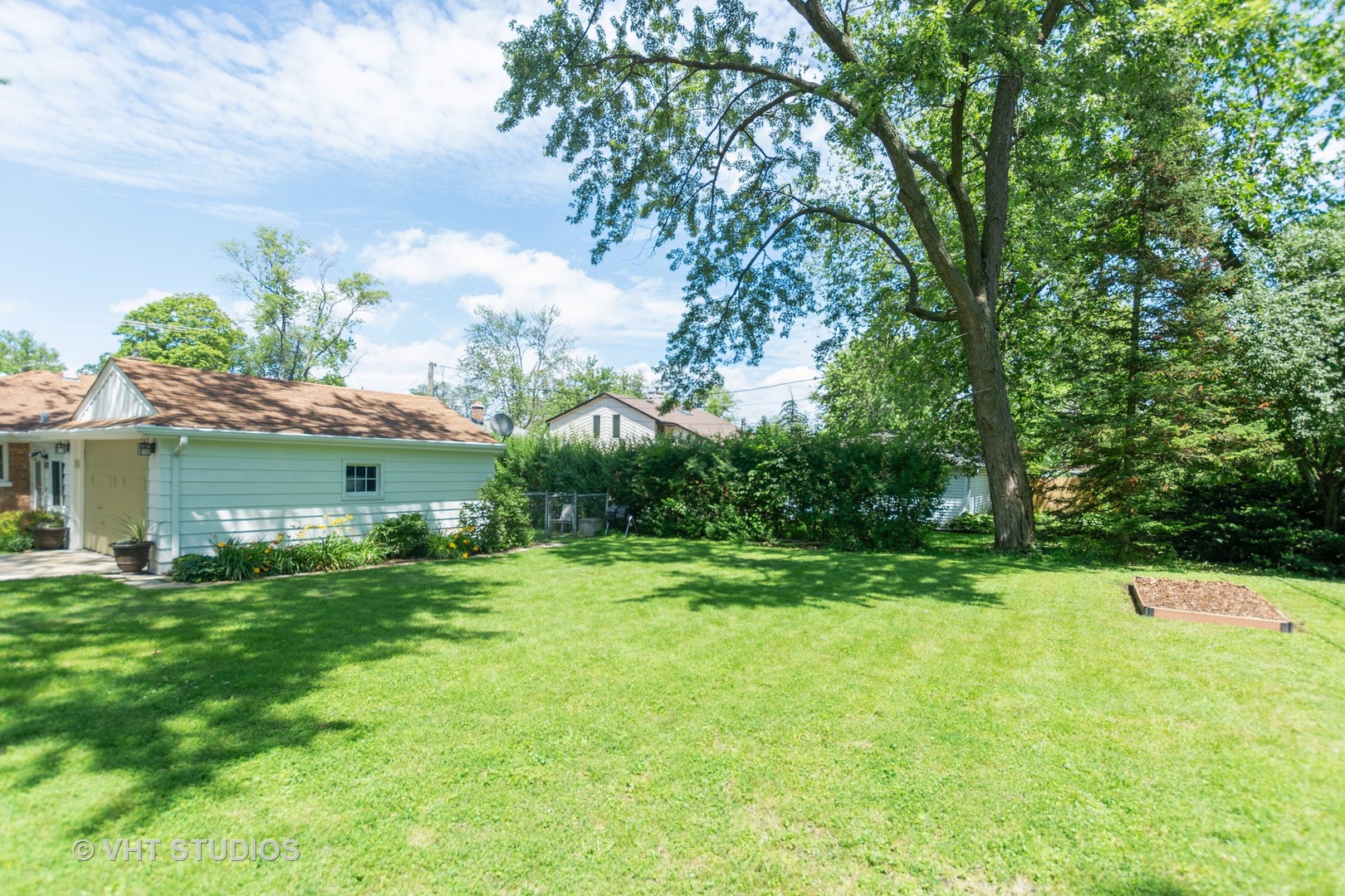 2233 Spruce Road Homewood, IL 60430 - Photo 17 of 17 a backyard of a house with plants and large trees