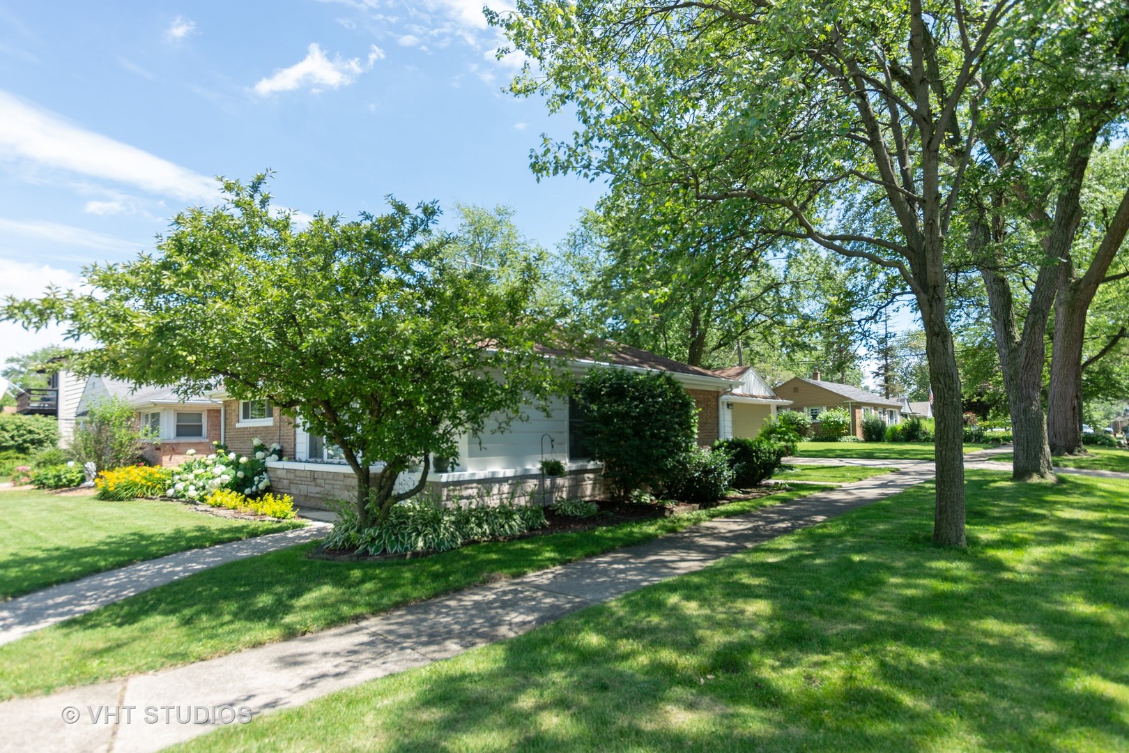 2233 Spruce Road Homewood, IL 60430 - Photo 3 of 17 a front view of a house with garden