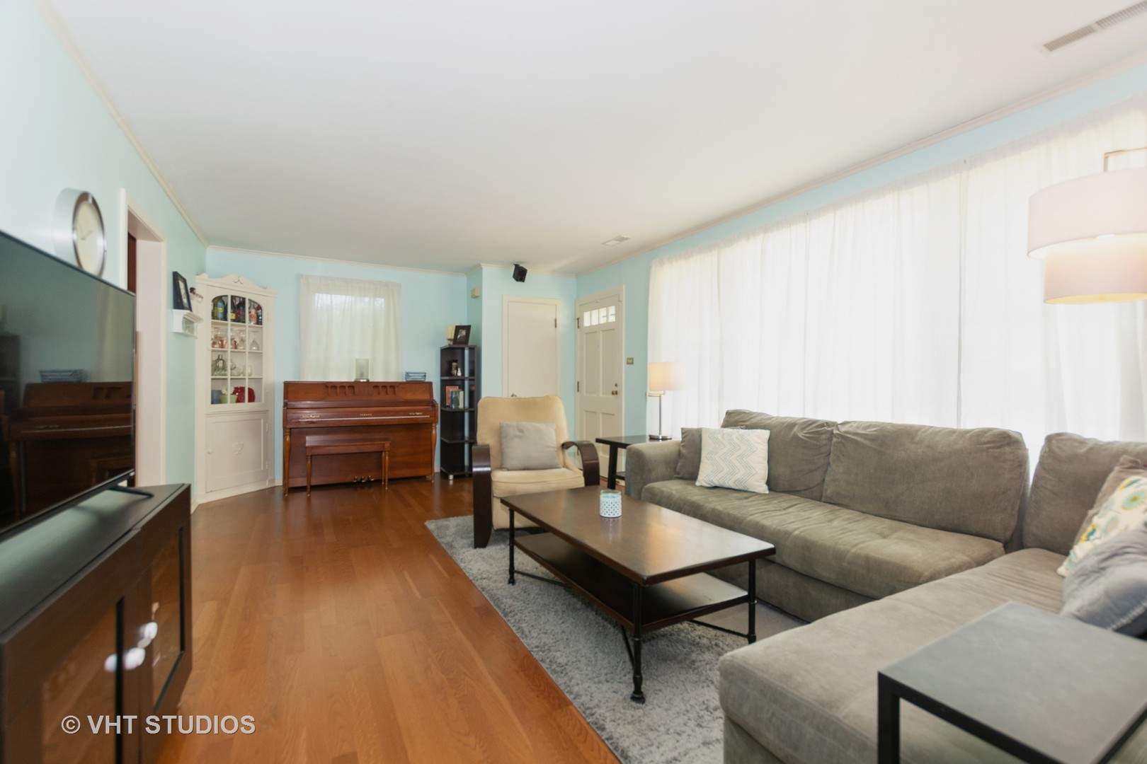 2233 Spruce Road Homewood, IL 60430 - Photo 5 of 17 a living room with furniture and a flat screen tv