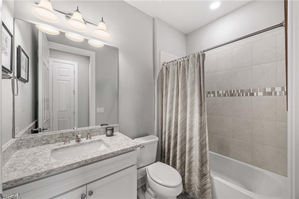 7658 Jacaranda Lane Naples, FL 34114 - Photo 15 of 30 Main Bathroom with shower / bath combo with shower